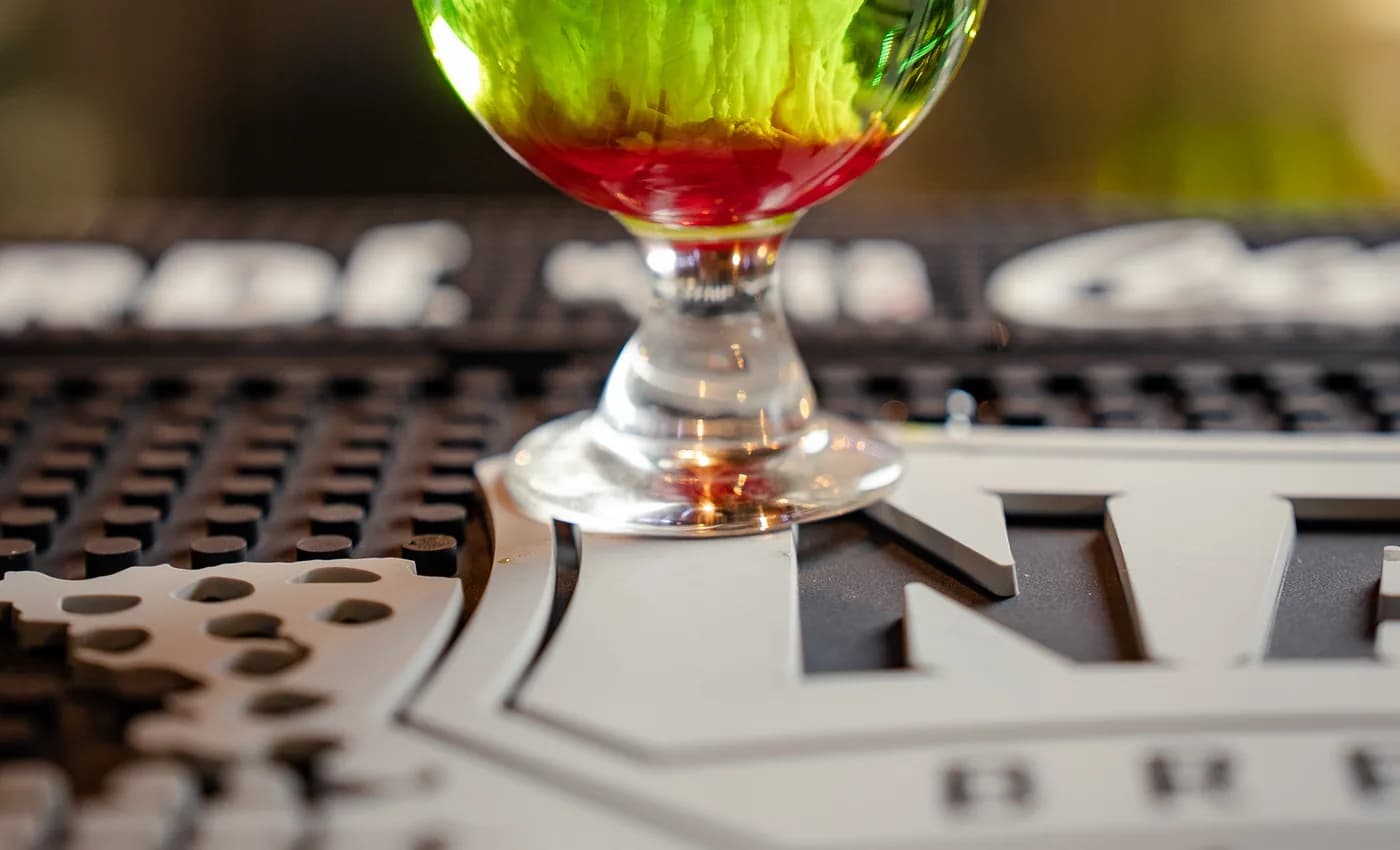 A colourful layered cocktail served on The Old Forge bar