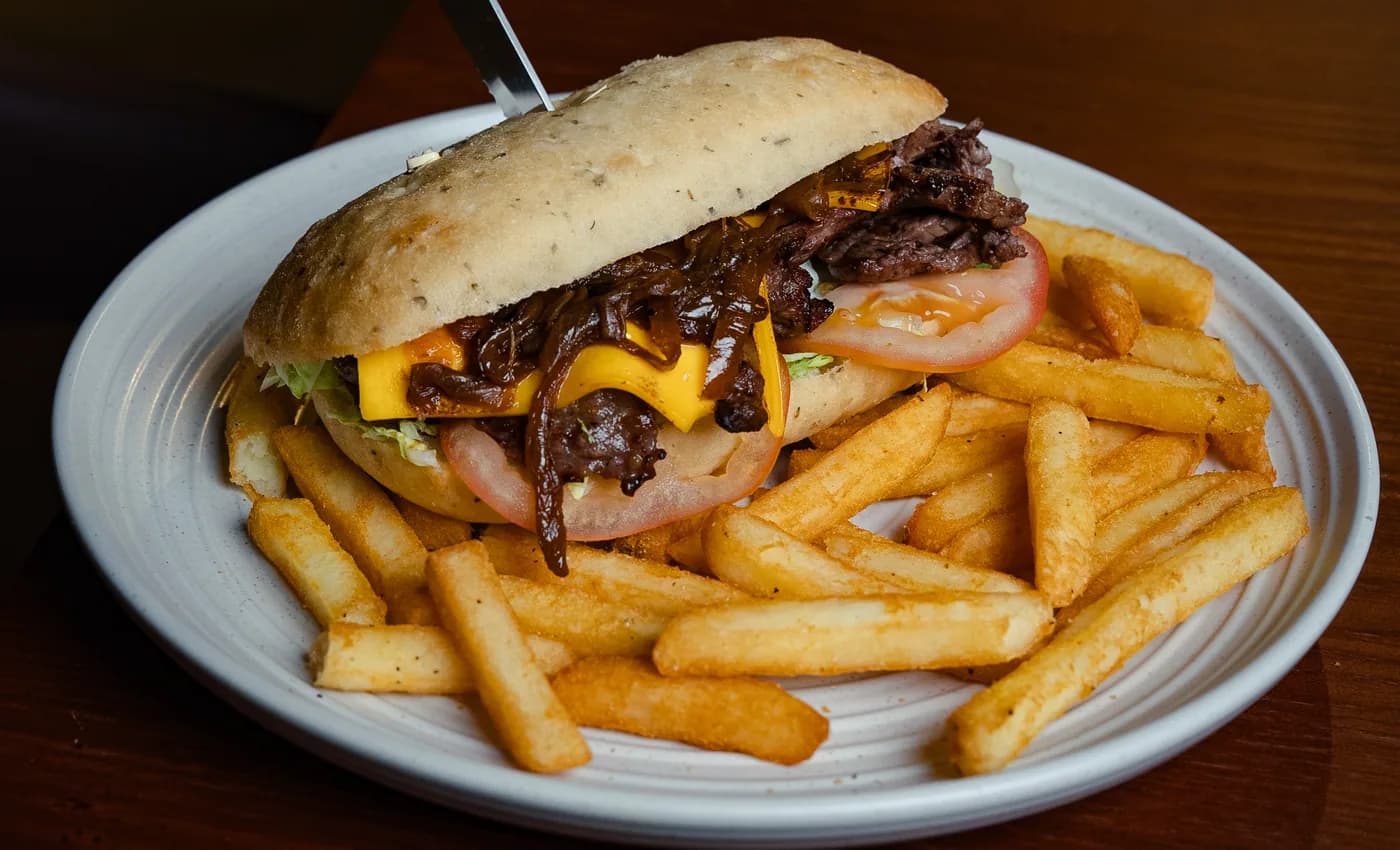 The Old Forge cheeseburger with caramelised onion and chips